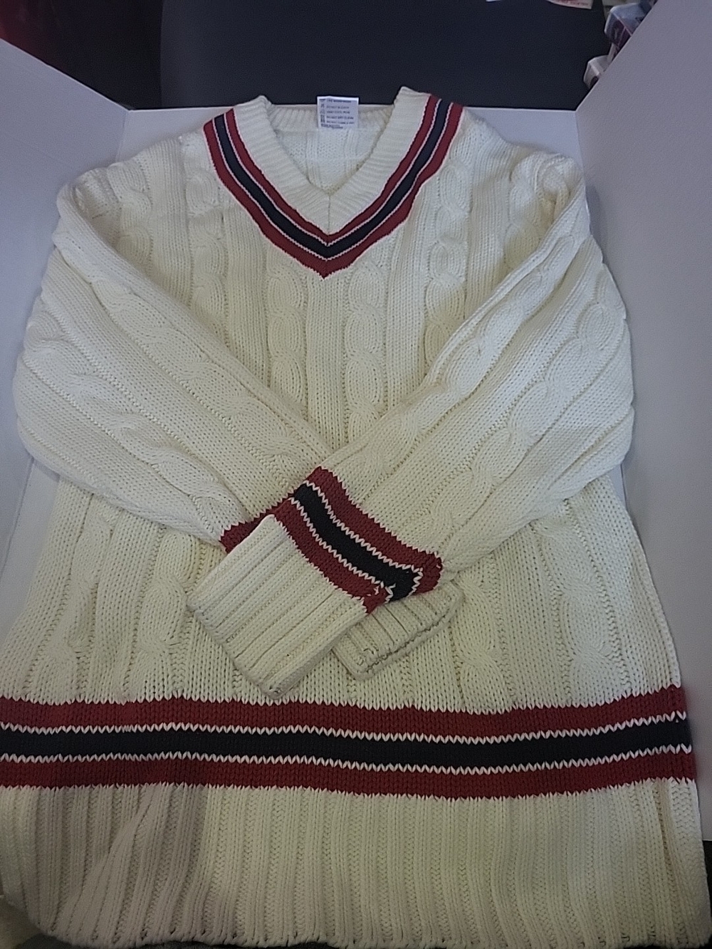 Cream Cable-Knit V-Neck Sweater with Red & Black Stripe Detail